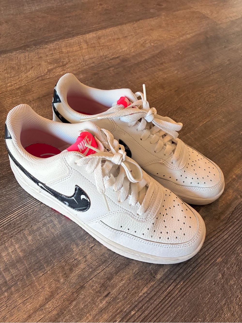 Nike White Leather Low-Top Sneakers with Black Marbled Swoosh and Pink Tongue
